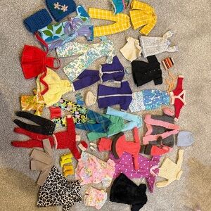 Colorful vintage Barbie Doll Clothing lot. With shoes